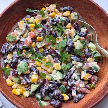 Indian rajma salad in a wooden bowl with a spoon on it.